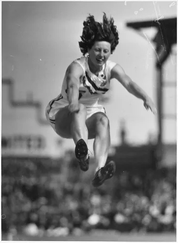 Image: Yvette Williams long jumping at Carisbrook, Dunedin