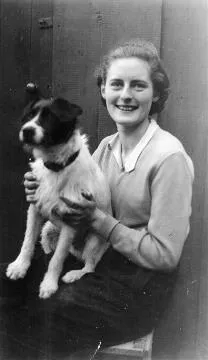 Annie Carroll holding a dog : digital image