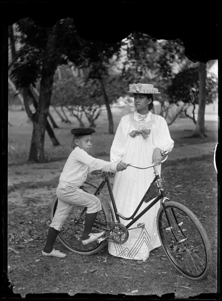 Woman and boy with bicycle