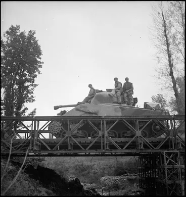 Image: NZ tank crossing Bailey bridge near Italian front, World War II - Photograph taken by George Kaye
