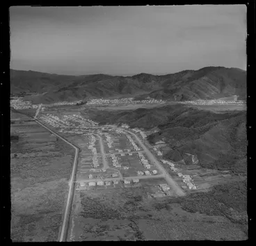 Image: View east to the Lower Hutt Valley suburb of Wainuiomata with the Wainuiomata Hill Road in the foreground, Wellington City