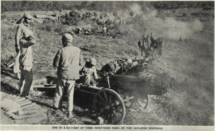 One of a battery of 75mm. howitzers fires on the Japanese positions