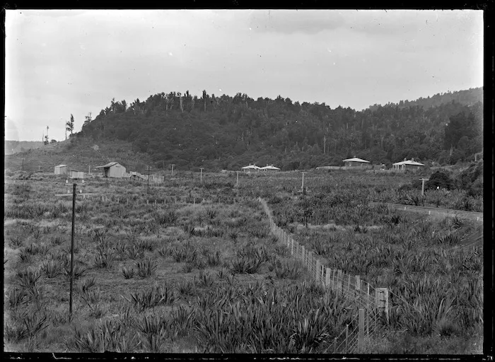 Erua, with the railway station and houses in the middle background.