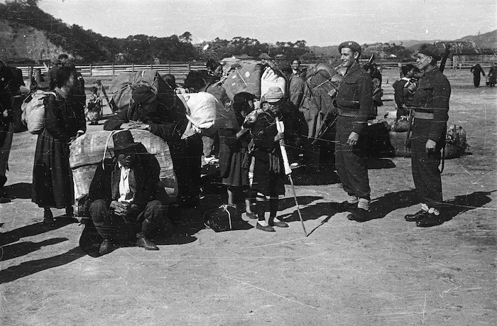 Korean repatriates loaded with their belongings