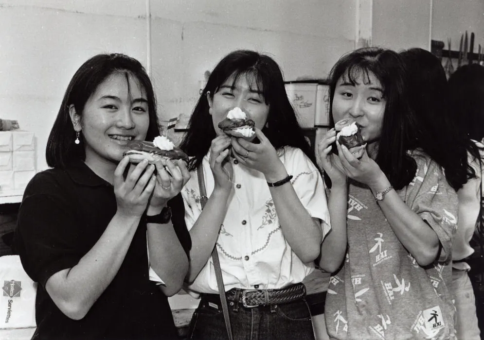 Japanese visitors Junko Misa, Emi Inada and Noriko Tonozuka tasting the chocolate eclairs they made at Buttercup Bakery.