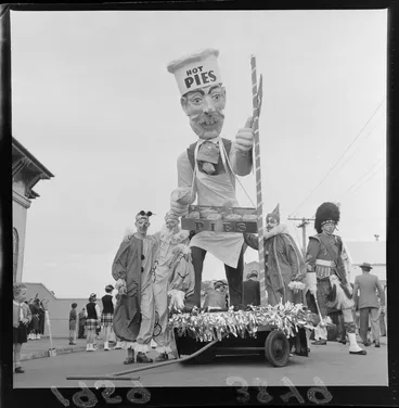 Image: James Smith's Christmas Parade, 'Hot Pies' float with a large puppet cook and three men dressed as clowns, Wellington Region