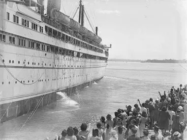 Image: [Crowd of people farewell group of passengers on ship]
