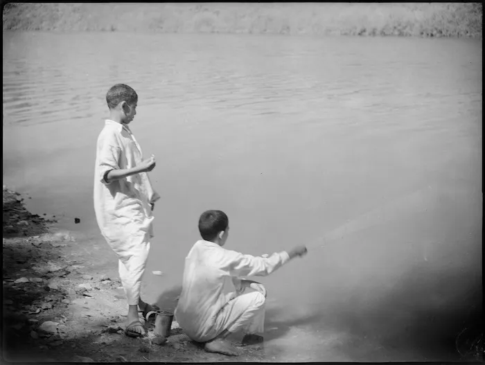 Wallads fishing in a canal, Egypt - Photograph taken by George Kaye