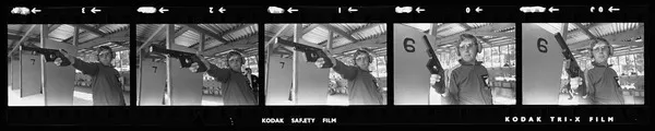 Bruce McMillan shooting a pistol