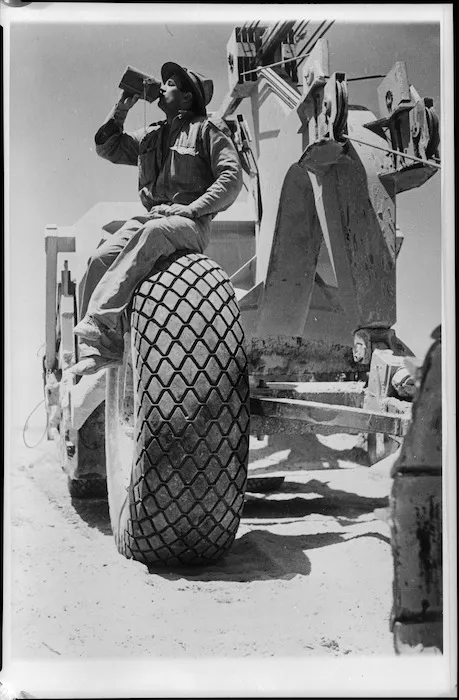 NZ engineer drinking water during work in the Western Desert