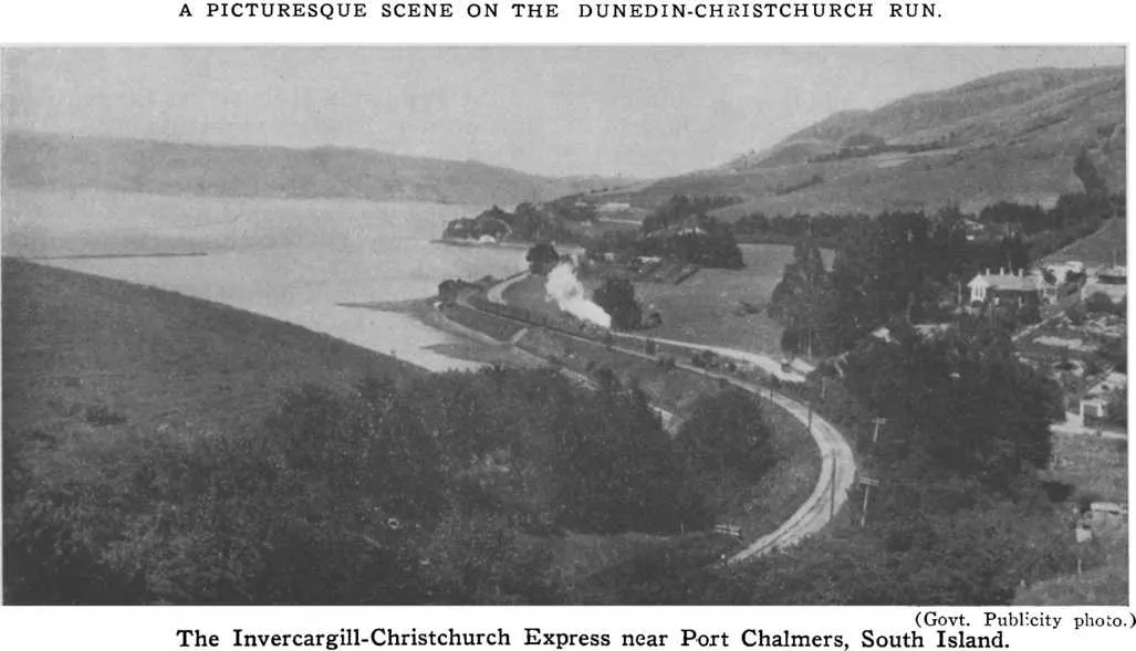 A Picturesque scene on the Dunedin-Christchurch run. — (Govt. Publicity photo.) — The Invercargill-Christchurch Express near Port Chalmers, South Island