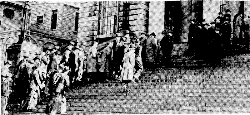 Members of the New Zealand Farmers' Union entering Parliament House yesterday afternoon to interview the Minister of Finance, Mr. Nash. They ivere followed by members of the Women's Division of the Farmers' Union, who* participated in the deputation. (Evening Post, 21 July 1945)