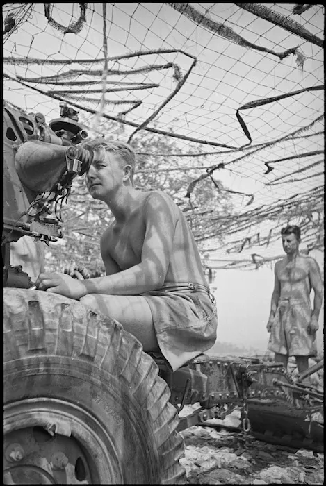 J C Nuttall, NZ Divisional Artillery, laying a gun on the Cassino Front, Italy, World War II - Photograph taken by George Kaye