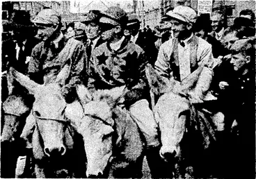 Image: E. T. Robson Photo. Lined up for the start of the "Donkey Derby." which created a lot of fun for a large crowd yesterday afternoon near the Air Raid Shelter in Featherston Street. The winner, J. Ellis, is on the right. (Evening Post, 15 March 1941)