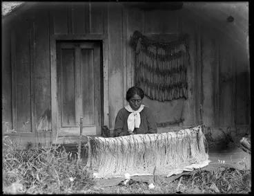 Image: Maori woman weaving a korowai (tag cloak)