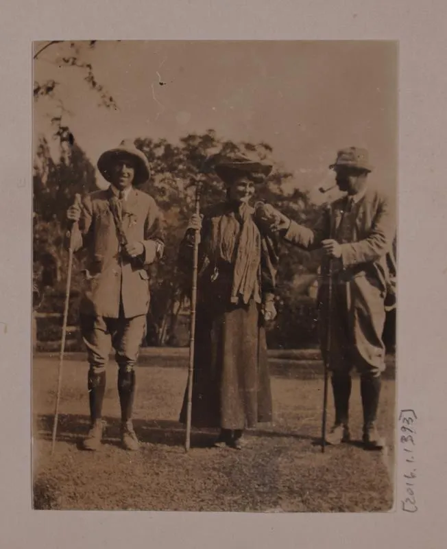Photograph: Three People Holding Staffs Ready for Peel Peaks Journey, January 1907
