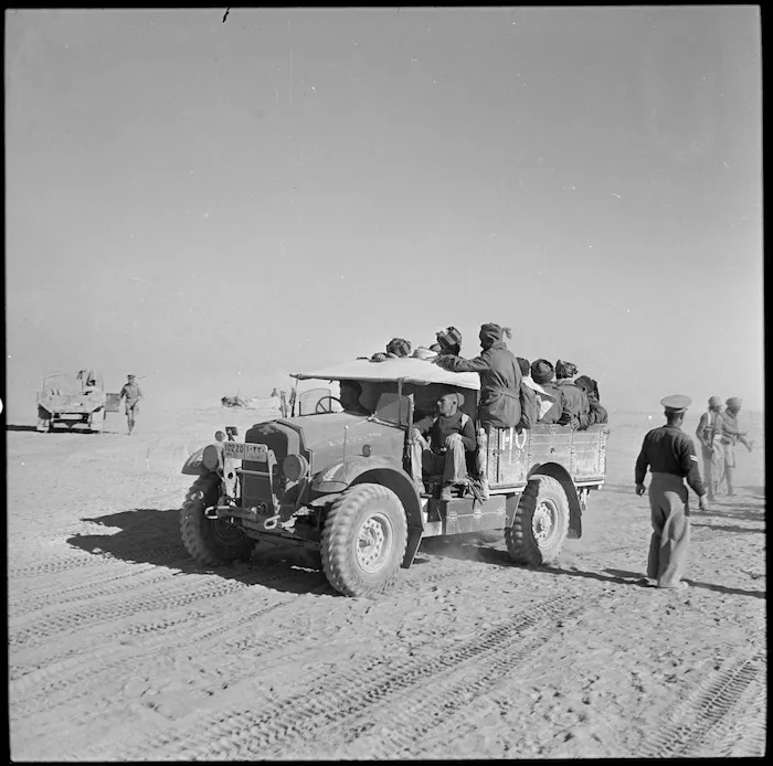 Loading Libyan prisoners onto NZ trucks for transport to POW cages