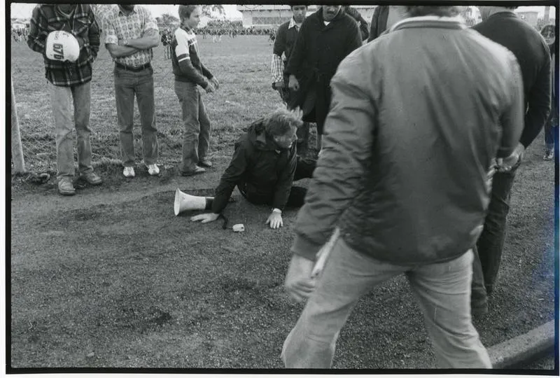"Tom Newnham (C.A.R.E.) being attacked outside field after game cancelled" - 1981 Springbok Tour