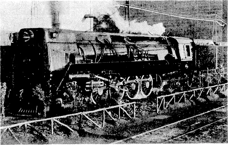 J. Stevens rhoto. The new KB type of streamlined engine recently constructed at the Hillside railway workshops, Dunedin. It is one of six of the type being built, to be used principally between Christchurch and Otira. These locomotives, in working order, weigh 145 tons, have a vAhe.elba.se of 62ft, and an overall length of 70ft. (Evening Post, 16 June 1939)