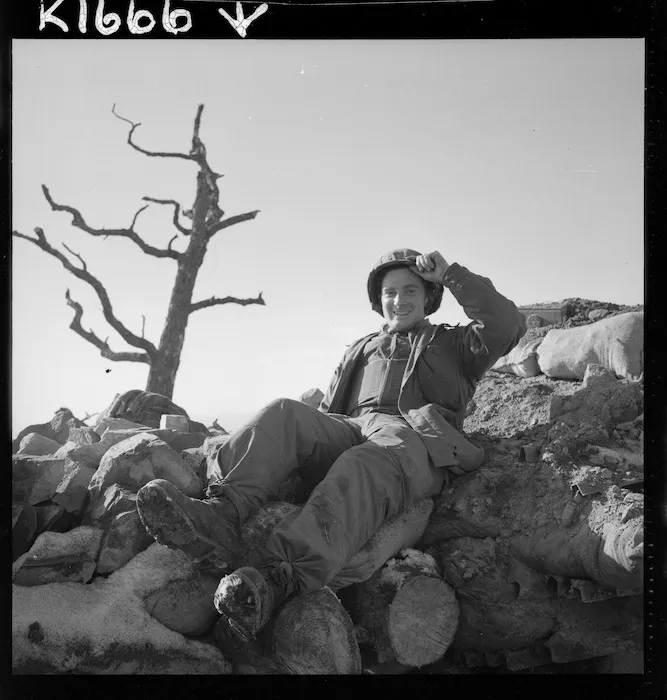 Lance Bombardier J M A Bright on the roof of his "hutchie"