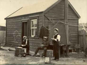Image: Miners outside hut