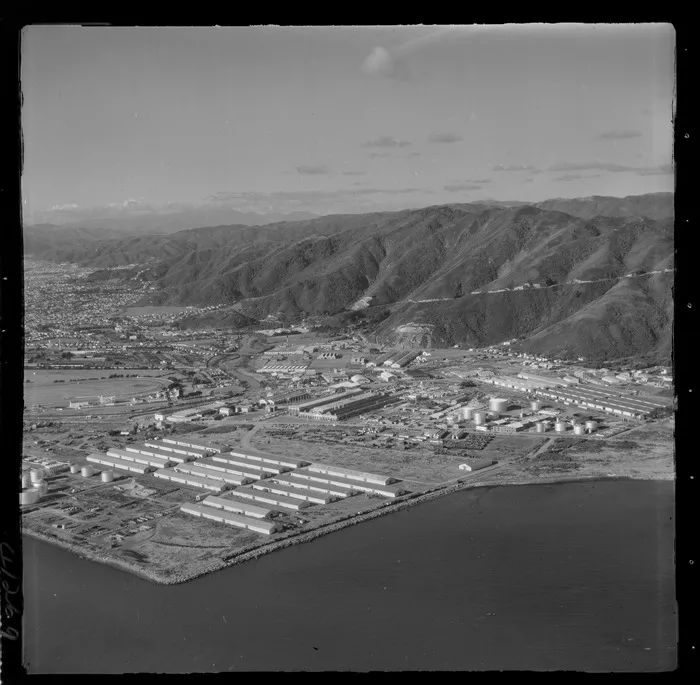 Lower Hutt suburb of Seaview with the Ford Motors Plant, fuel storage tanks and other industrial buildings, with Wainuiomata access road beyond, Wellington Region