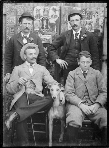 Image: Men, boy, and a dog