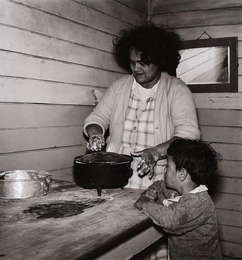 She puts the four balls of dough into a special iron pot on legs called a camp-oven. From the series: Washday at the pa
