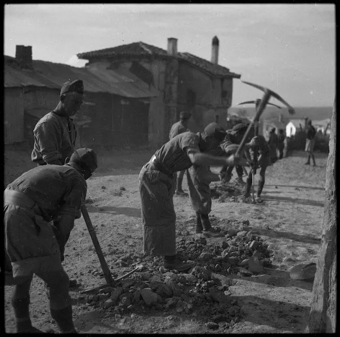 NZ infantrymen repairing road through a Greek village