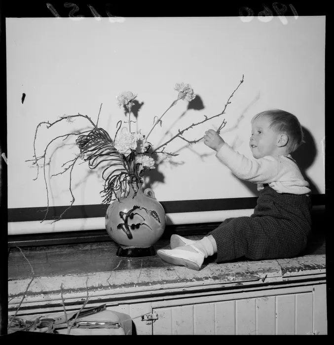 22-month-old Jonathan Gill with an Ikebana floral arrangement at the YMCA in Wellington