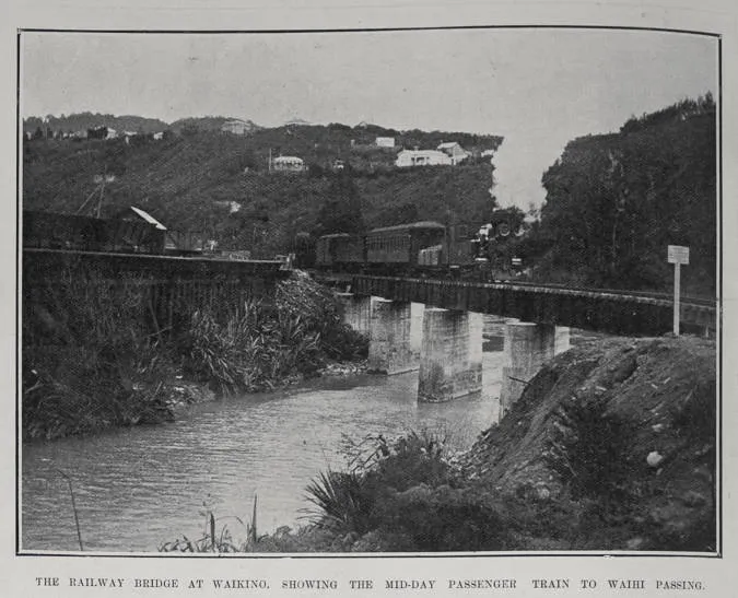 THE RAILWAY BRIDGE AT WAIKINO, SHOWING THE MID-DAY PASSENGER TRAIN TO WAIHI PASSING