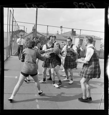 Image: Men dressed in gym slips playing netball against women, Department of Health, Wellington
