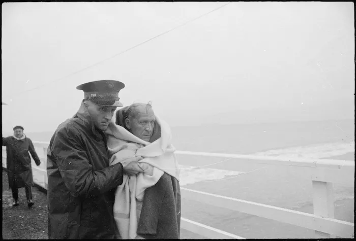 Survivor from Wahine shipwreck with Salvation Army Cadet Keith Goodisson on wharf in Seatoun, Wellington