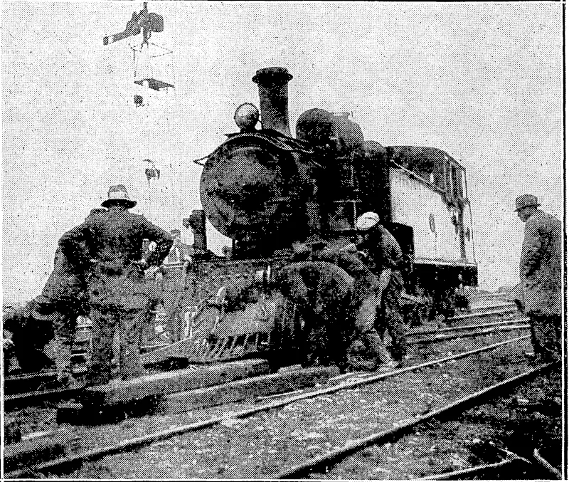 Evening.' Post" Photo. 'OFF THE LINE AT, NGAHAURANGA.—Traffic on the out line between.. Ngahquranga and-Petone was held up for the: greater part:of to-day by the derailment of the engine of a morning Wellingifin-Petpne ,-;:-7' 77; '. train. No serious damage was done. , (Evening Post, 13 April 1932)