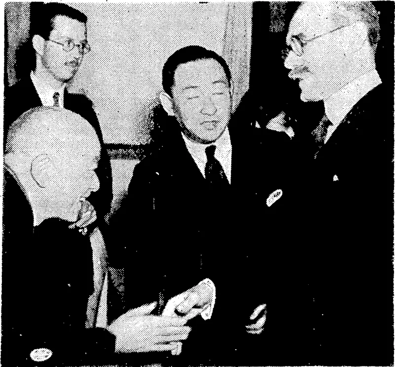 Evening Post" Photo. A mechanical "carry-all" making a cut across the bed of -the- Hutt River to deflect the flow of the water in an attempt to save a portion of the banks endangered by erosion.. Sir Robert Craigie, British Ambassador to Tokio, meeting Manzaburo Umewaka, famous actor '■ of ancient Japanese drama, after a performance by the actor at Umetvaka Theatre, in Tokio. Baron Takakimi Mitsui, of .the famous Japanese business house of Mitsui, . . is making the introduction. (Evening Post, 04 October 1940)