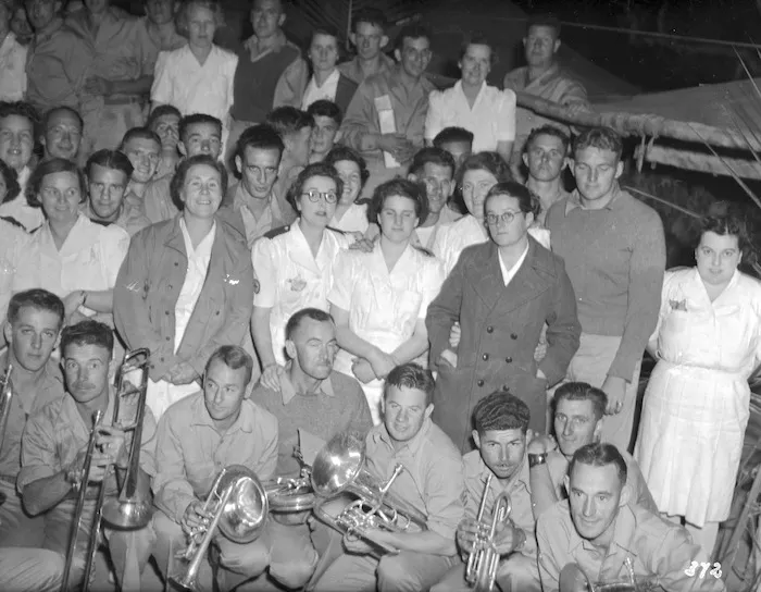 Members of the Field Bakery entertain sisters and members of the Women's Army Auxiliary Corps at an impromptu dance, Pacific area