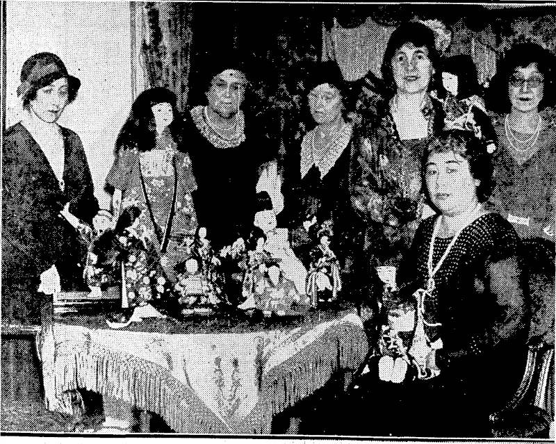 i . "Sport and General" Photo. ENGLAND'S CHAMPION BUTTER-MAKER.-MwM. B. Ashley, of Lancashire, with the Desborough Challenge, Cup, .which she ivon on 21st October at the Royal Agricultural Hall, London, for butter•'••'■■ making, , , ' . ' : '■ ' ' ' "Sport and General" Photo. FESTIVAL OF DOLLS.—Mrs. Malsudaira, wife of the Japanese Ambassador to the Court of St. James' explaining to her friends at a tea-parly in London the history of, the Festival of Dolls, which is celebrated each year in Japan. The festival dolls are not ordinary "Ningyo," to be carried about by a child but perfect miniature figures representing the Emperor and Empress, with ladies-in-waiting, archers, swordbearers, musicians, and courtiers, all in costumes, correct in every detail. This original tea-party ivas given at the Japanese Embassy in Grosvcnor Square, London, on 26th October, at which there ivas a display of all the ceremonial attendant on this important Japanese national function. . (Evening Post, 02 December 1932)