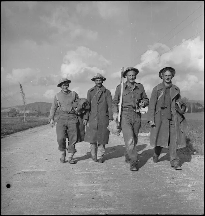 Four NZ sappers walking back from the front line in Sangro River area, Italy, World War II - Photograph taken by George Kaye