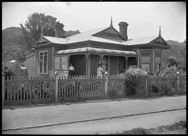 Image: Bungalow with verandah and paling fence.