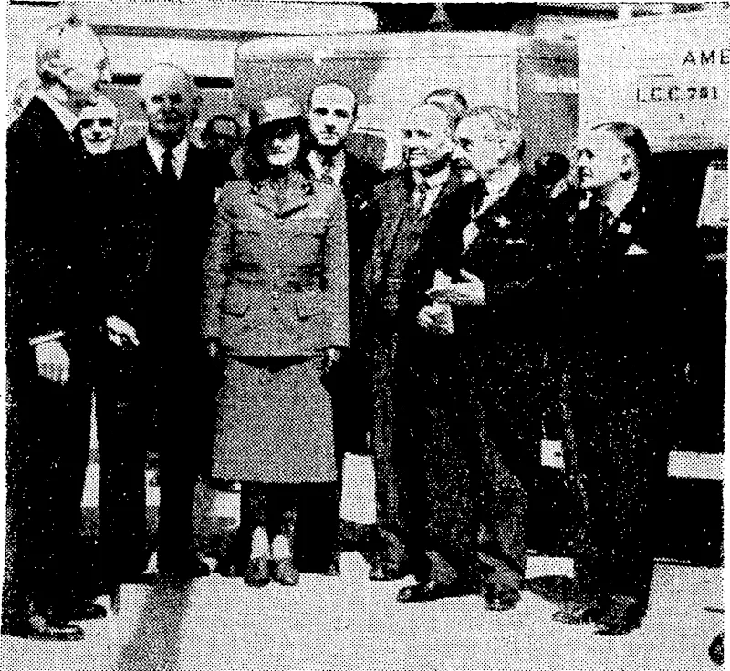 Miss Jean Batten, famous New Zealand airwoman, with Sir George Franckenstein, Mr. Emil Davies, M.P., chairman of the London. County Council) and Sir William Bragg, when an-ambulance wagon ivas presented by the Ambulance Trust Fund. (Evening Post, 25 June 1940)
