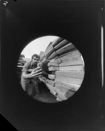 Image: Man painting wood