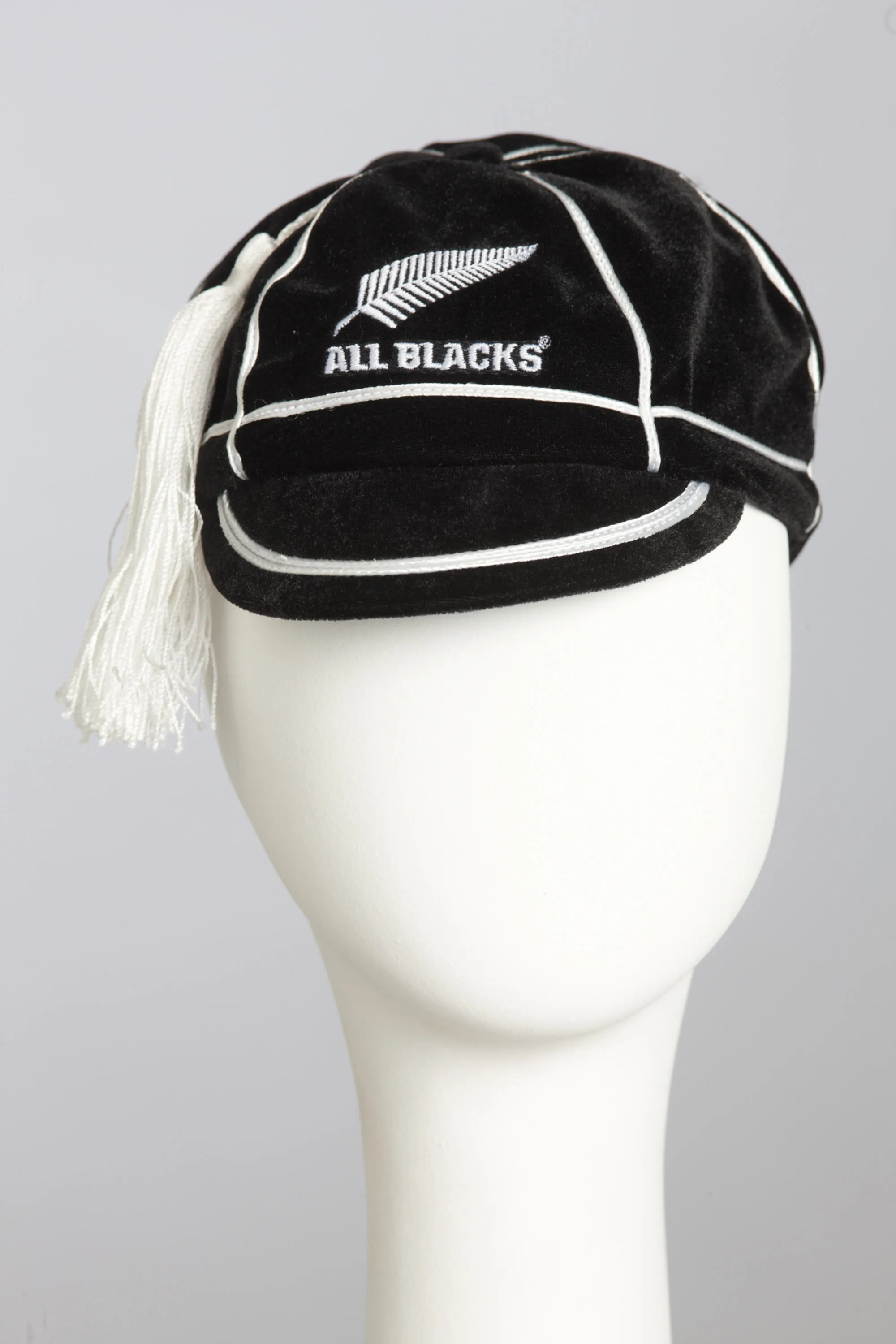 All Black cap with white tassle