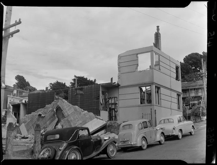 A house being demolished on The Terrace, Wellington City, including parked cars