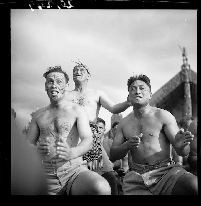 Members of the Maori Battalion performing a haka at the opening of the meeting house Tamatekapua, at Ohinemutu