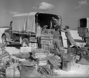 Image: Soldiers loading a truck with a unit's rations at an Army Service Corps supply depot, Egypt
