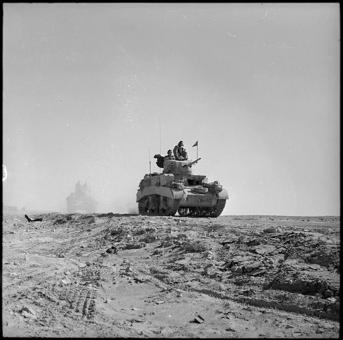 Honey tanks churn up dust along desert road, Egypt - Photograph taken by H Paton