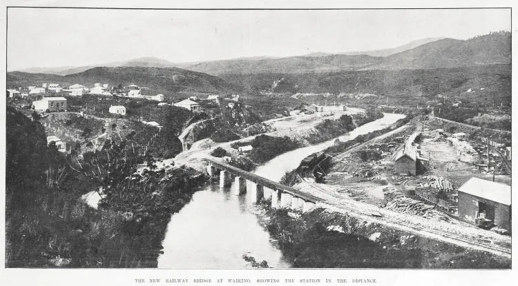 THE NEW RAILWAY BRIDGE AT WAIKINO. SHOWING THE STATION IN THE DISTANCE