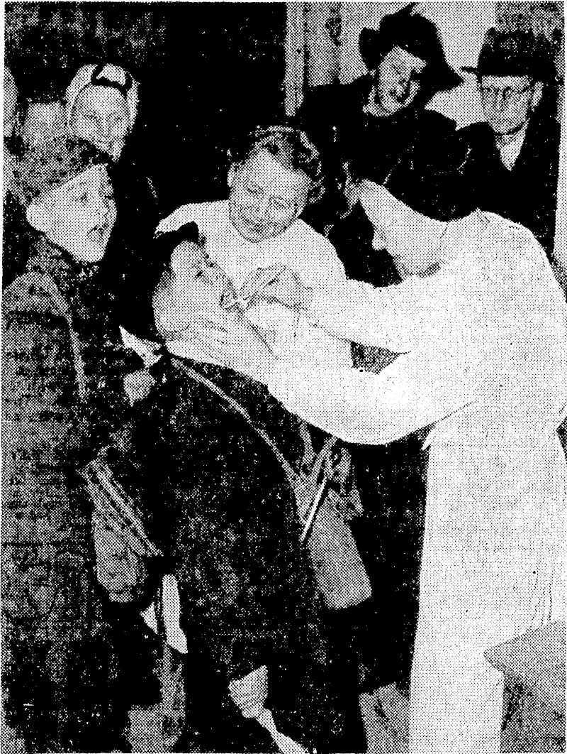 Some 50,000 Berlin school children have been evacuated from the British sector as a precaution against epidemics this winter,many of the youngsters going to Westphalia and the rest to various towns and villages. German nurses are here seen examining the throats of children before they leave. (Evening Post, 14 December 1945)