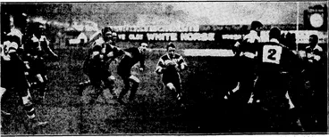 Image: Evening Post" Photo. FLIGHT – LIEUTENANT G. B. BOLT, appointed assistant instructor ••• and ground ; engineer to/ the Wellington Aero Club. . 1 ' ' -Sydney Morning Herald" Photo. NEW ZEALAND UNIVERSITY DEFEATS NEW ■ SOUTH 'WALES. -—Forwards reachingfor the ball during ihe match between New South) Wales and the New Zealand,University team at University Oval, ; Sydney, last Wednesday. The visitors won by 28 to 10. ■_■■■ AN INCIDENT IN THE PONEkE-HUTT SENIOR A GRADE RUGBY^ AFTERNOON.r—SadIer, the Him-half-back, starting an attack with Ball in support. M to check the movement. ' Ihitt were defeated for the first- time this[season,' Poneke ivinningbyi 16 points to 6. . .' . . . ' ' (Evening Post, 15 June 1931)