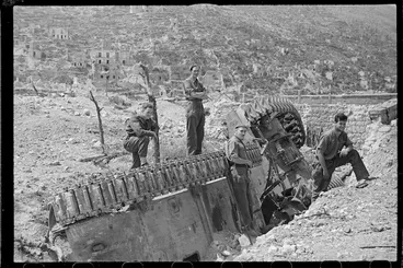 Image: Soldiers examining a knocked out tank, Cassino, Italy, the day it fell to the Allies - Photograph taken by George Kaye